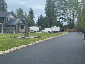 paved road on the side of a lawn